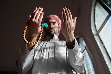 Image showing muslim prayer inside the mosque in namaz worship Allah