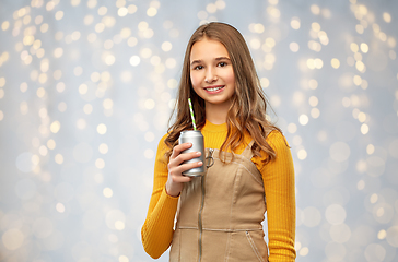 Image showing happy teenage girl drinking soda from can