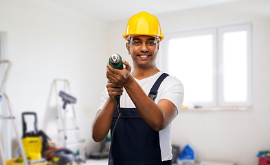 Image showing happy indian builder in helmet with electric drill