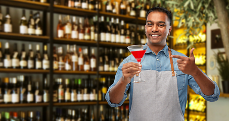 Image showing indian barman with glass of cocktail at bar