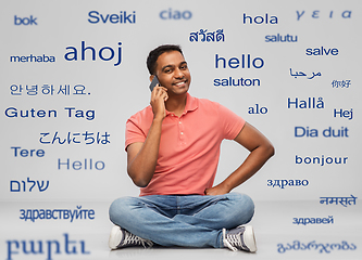 Image showing happy indian man calling on smartphone