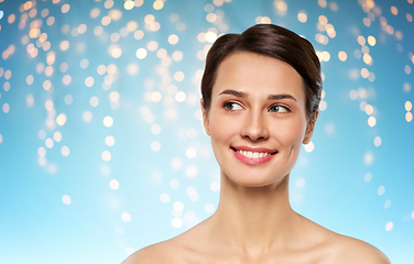 Image showing beautiful smiling young woman with bare shoulder