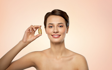 Image showing beautiful young woman with gold facial mask