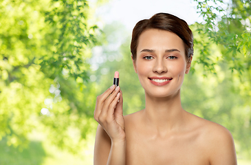 Image showing beautiful smiling young woman with pink lipstick