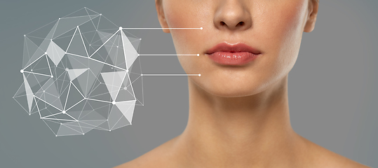 Image showing woman with futuristic pointers showing face skin