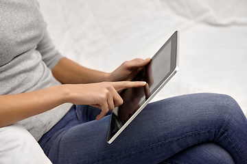 Image showing close up of young woman with tablet computer