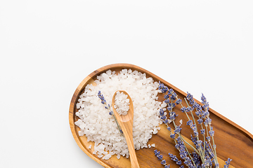 Image showing sea salt heap and lavender on wooden tray