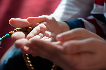 Image showing muslim prayer father and son in mosque prayingtogether