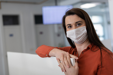 Image showing call center operator in medical mask