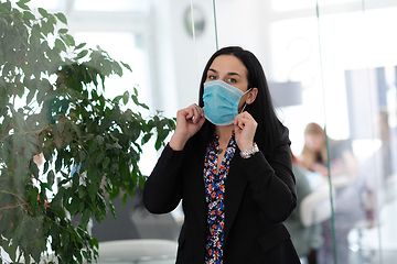 Image showing business woman portrait in medical protective mask