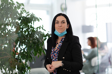 Image showing business woman portrait in medical protective mask