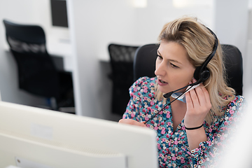 Image showing call center operator in medical mask