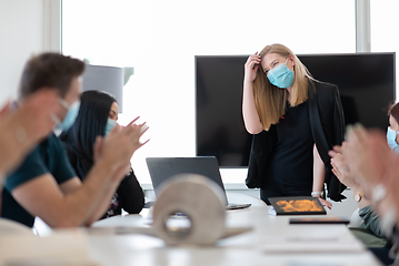 Image showing real business people on meeting wearing protective mask