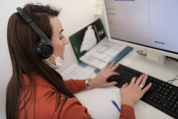 Image showing call center operator in medical mask