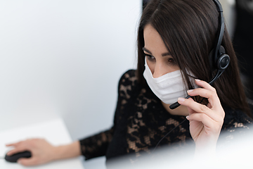 Image showing call center operator in medical mask