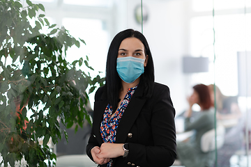 Image showing business woman portrait in medical protective mask