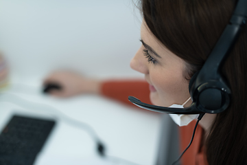 Image showing call center operator in medical mask