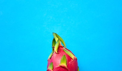 Image showing close up of dragon fruit or pitaya on blue