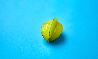 Image showing ripe carambola or star fruit on blue background