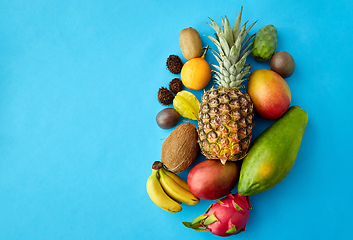 Image showing many different exotic fruits on blue background