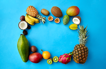 Image showing different exotic fruits on blue background