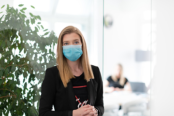 Image showing business woman portrait in medical protective mask