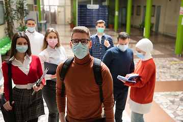 Image showing Portrait of multiethnic students group at university wearing protective face mask