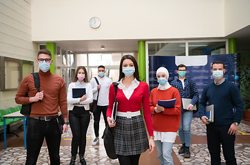 Image showing students group at university walking and wearing face mask