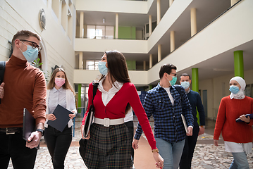 Image showing students group at university walking and wearing face mask