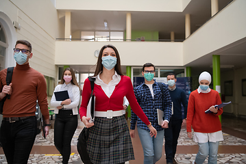 Image showing students group at university walking and wearing face mask