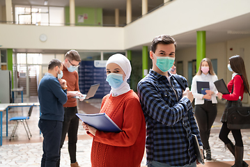 Image showing Portrait of multiethnic students group at university wearing protective face mask