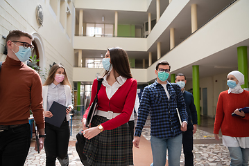 Image showing students group at university walking and wearing face mask