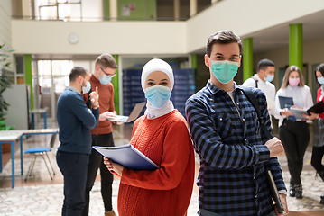 Image showing Portrait of multiethnic students group at university wearing protective face mask