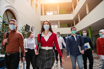 Image showing students group at university walking and wearing face mask