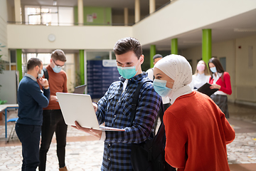 Image showing Portrait of multiethnic students group at university wearing protective face mask