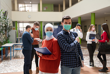 Image showing Portrait of multiethnic students group at university wearing protective face mask