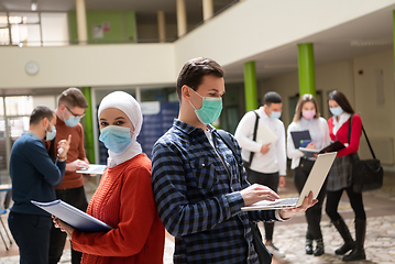 Image showing Portrait of multiethnic students group at university wearing protective face mask