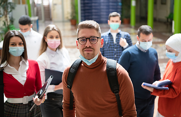 Image showing Portrait of multiethnic students group at university wearing protective face mask