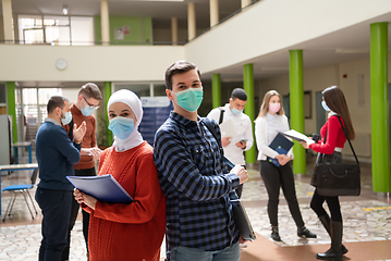 Image showing Portrait of multiethnic students group at university wearing protective face mask