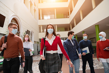 Image showing students group at university walking and wearing face mask