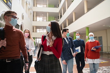 Image showing students group at university walking and wearing face mask