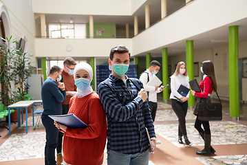 Image showing Portrait of multiethnic students group at university wearing protective face mask