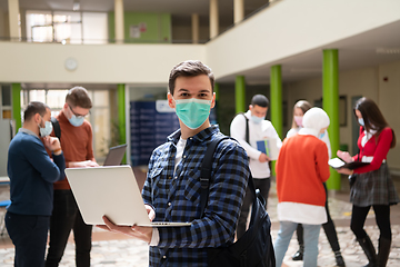 Image showing Portrait of multiethnic students group at university wearing protective face mask