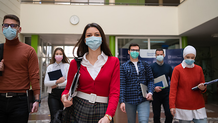 Image showing students group at university walking and wearing face mask