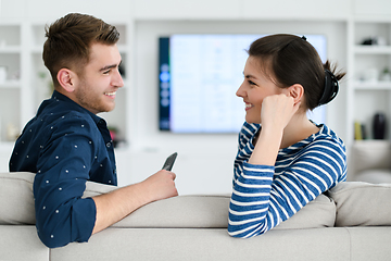 Image showing a young married couple enjoys sitting in the large living room