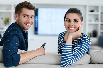 Image showing a young married couple enjoys sitting in the large living room