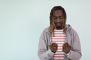 Image showing Young African Muslim Man Making Traditional Fatiha Prayer To Allah