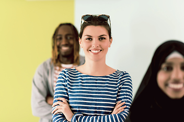 Image showing group of diverse teenagers posing in a studio, determined teenagers in diverse clothing.