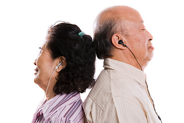 Image showing Senior asian couple listening to music