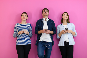 Image showing group of friends have fun and dance while using a cell phone and headphones